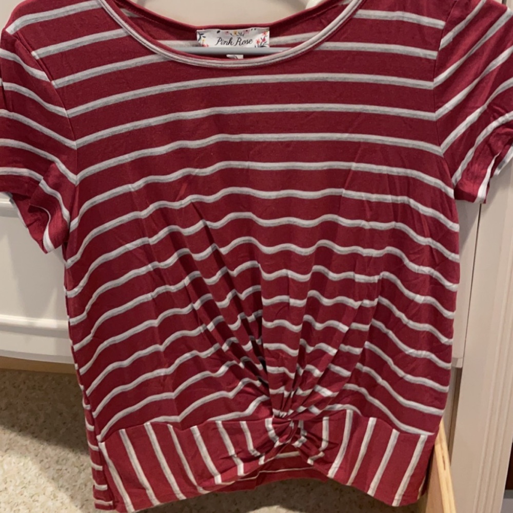 red and white striped t shirt with tie at bottom